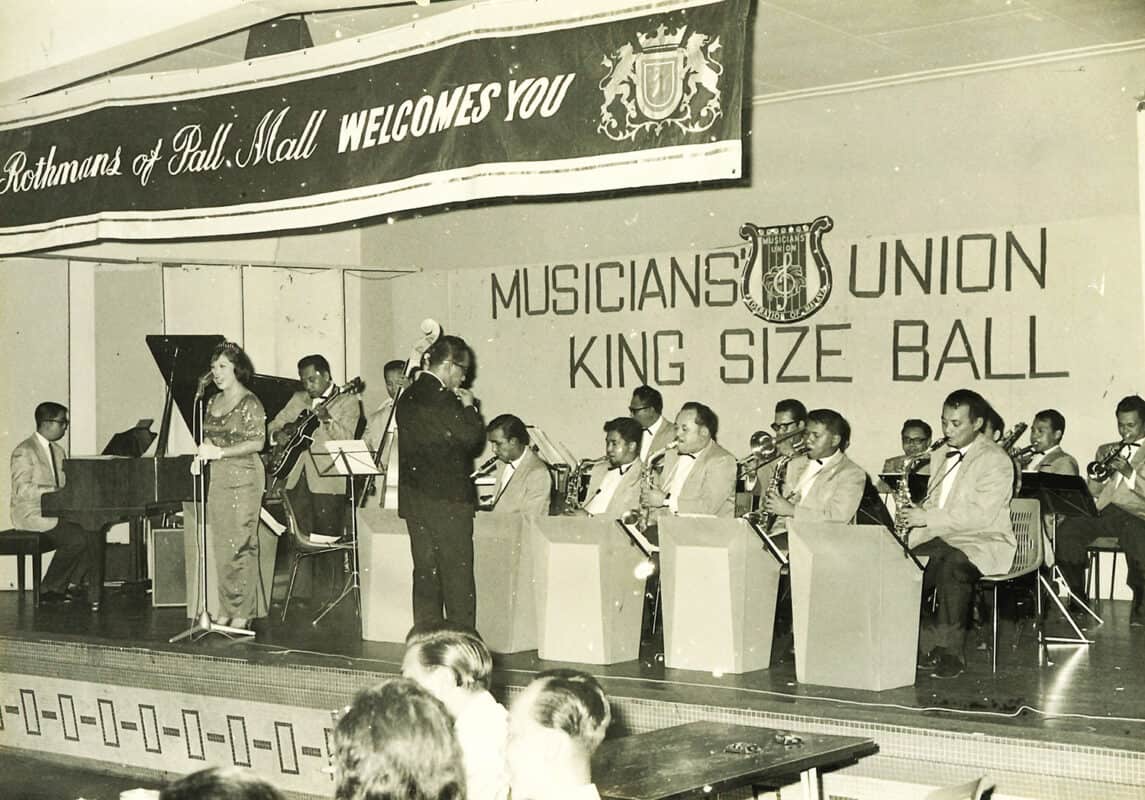 ooi eow jin on piano (far left) with rtm orchestra performing at musicians' union 4th annual ball 1964