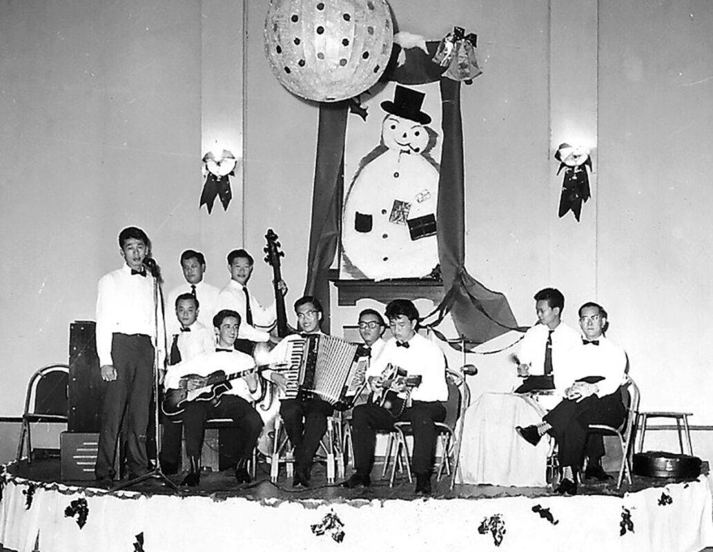 (lee chong heen) the jokers at penang sports club christmas 1959 (lee chong heen on accordion)